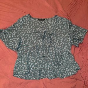 Green floral blouse.